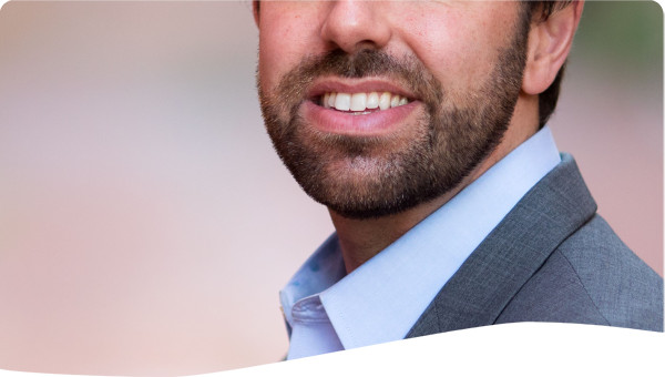 Photo of Patrick Reilly from the waist up.