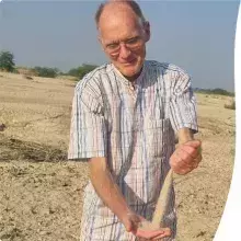 Pieter playing with sand